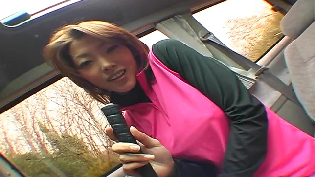 Busty teen plays with cock while in the car