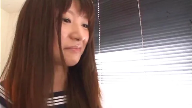 Attractive Japanese schoolgirl Rio Ogawa gives a handjob 3